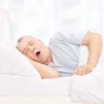 Senior man snoring while sleeping