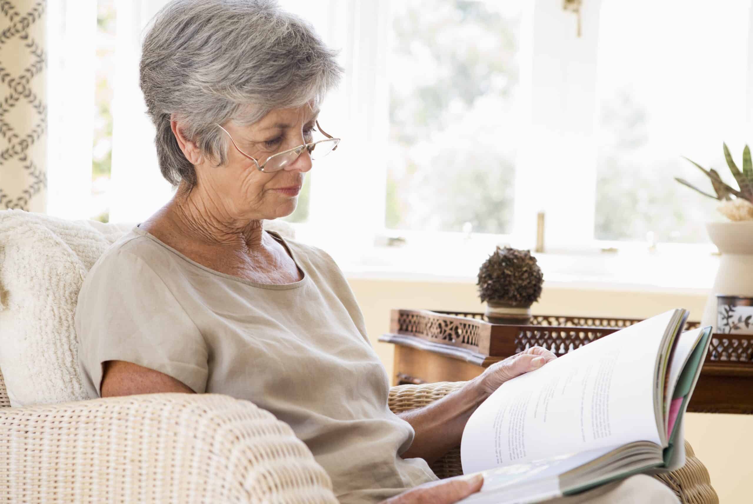 Senior woman reading at home